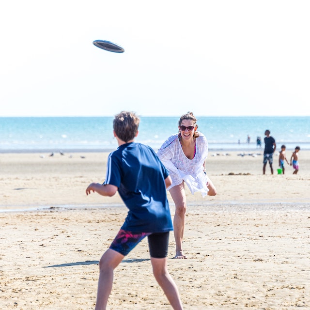 Friends playing on the beach