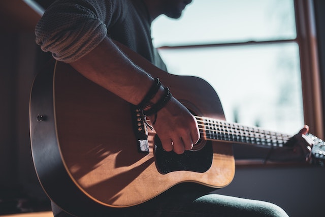 Person playing guitar